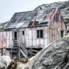 Maddi Ring - HOUSE ON THE HILL  Fine Art Photography. 20 x 16 inches. 50.8 x 40.64 cm Limited edition. Manually signed and numbered.  This is an image shot in Greenland with a Nikon DSLR. The house's distressed wood sides captured my eye as we motored through the waterways filled with icebergs. It is available as an archival print to be shipped in a tube ready to be matted. It is a limited edition of 10, and the print will be hand-signed. Other sizes are available on request, metal prints.