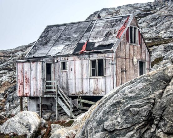 Maddi Ring - HOUSE ON THE HILL  Fine Art Photography. 20 x 16 inches. 50.8 x 40.64 cm Limited edition. Manually signed and numbered.  This is an image shot in Greenland with a Nikon DSLR. The house's distressed wood sides captured my eye as we motored through the waterways filled with icebergs. It is available as an archival print to be shipped in a tube ready to be matted. It is a limited edition of 10, and the print will be hand-signed. Other sizes are available on request, metal prints.
