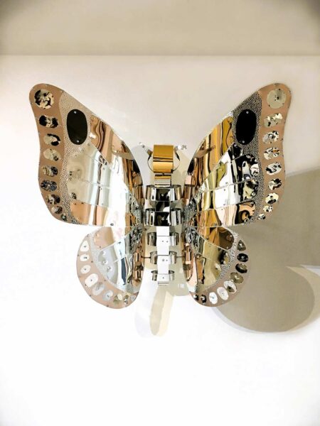 Chelita Zuckermann | FLYING FLOWER - BUTTERFLY. 2023 Original Art. Sculpture. Polished, hammered, and anodized aluminum. Assembled with bolts and rivets. 100x125x32 cm. W. 4 kg. Signed. 
